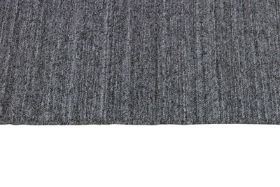 Laagpolig vloerkleed MOMO Rugs Nouveau Plain Dark Grey